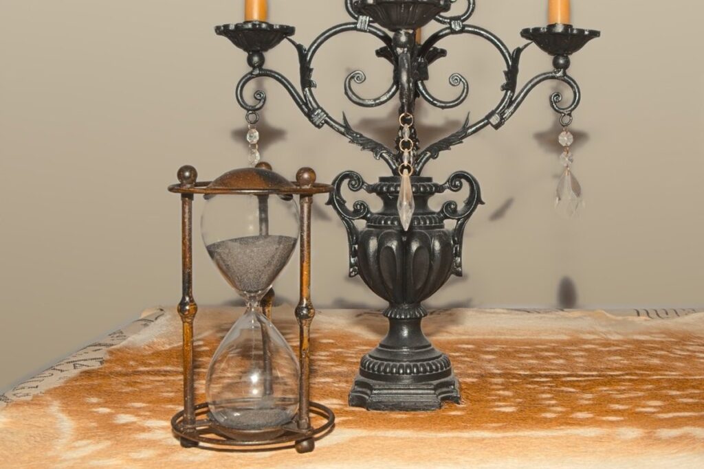 antique hourglass and candelabra