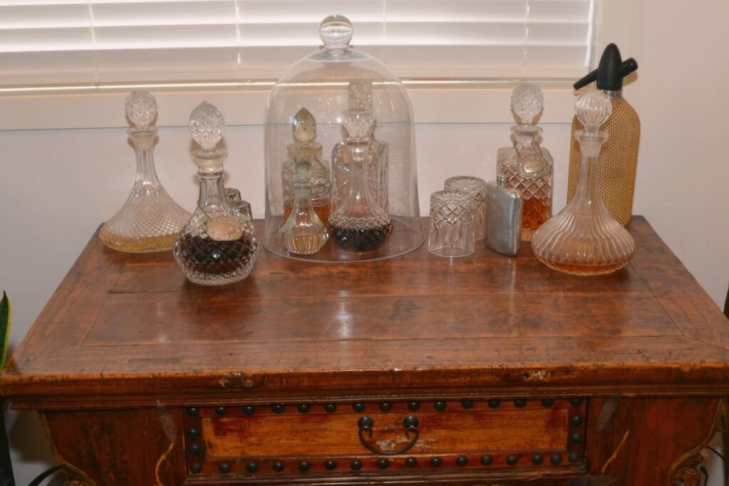 Antique wooden chest with crystal decanters
